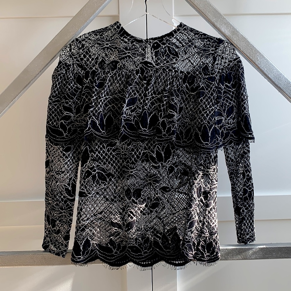 Black and white lace blouse with faux off-the-shoulder effect